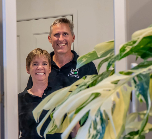 About: a couple standing in front of a door.